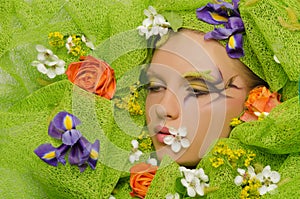 Portrait of beautiful woman in flowers