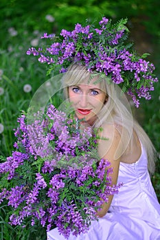 Portrait the beautiful woman with flowers photo