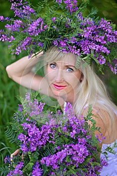 Portrait the beautiful woman with flowers photo