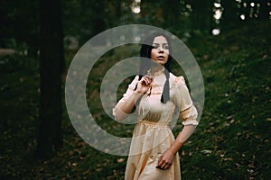 Portrait of a beautiful woman in the forest