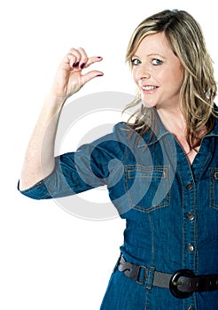 Portrait of beautiful woman gesturing small bit