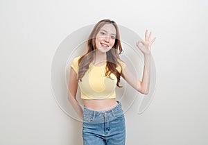 Portrait beautiful woman with hand show ok or agree hand sign