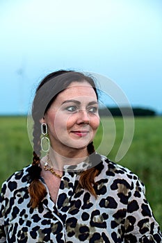 Portrait of a beautiful woman in her fifties outdoors