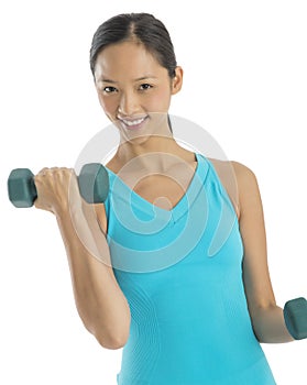 Portrait Of Beautiful Woman Lifting Dumbbells