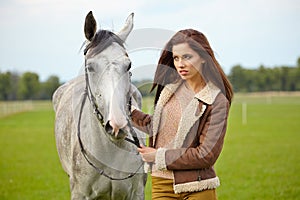 Portrait beautiful woman long hair next horse
