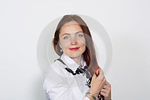 Portrait of a beautiful woman looking at camera over white background