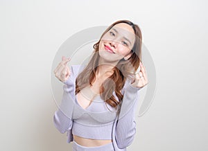 Portrait beautiful woman with mini heart hand sign