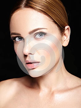 Portrait of beautiful woman model with makeup and clean healthy skin