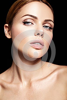 Portrait of beautiful woman model with makeup and clean healthy skin
