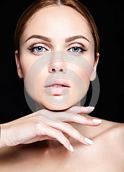 Portrait of beautiful woman model with makeup and clean healthy skin