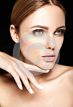 Portrait of beautiful woman model with makeup and clean healthy skin