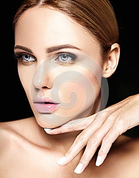 Portrait of beautiful woman model with makeup and clean healthy skin