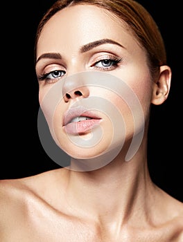 Portrait of beautiful woman model with makeup and clean healthy skin