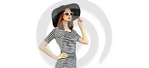 Portrait of beautiful woman model wearing black round summer hat, striped dress isolated on white background