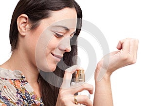 Portrait of beautiful woman with perfume