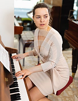 Portrait beautiful woman playing piano