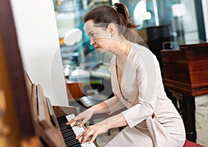 Portrait beautiful woman playing piano