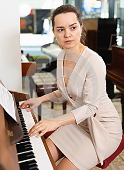 Portrait beautiful woman playing piano