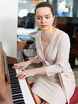 Portrait beautiful woman playing piano