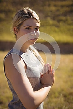 Portrait of beautiful woman praising yoga during obstacle course