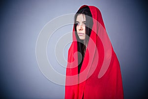 Portrait of a beautiful woman in red cloth