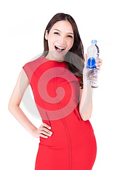 Portrait beautiful woman in a red dress Showing a happy expression , While holding a water bottle in her hand on a white