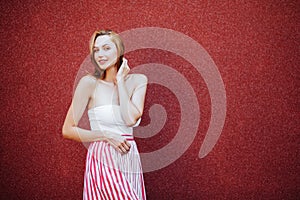 Portrait of beautiful woman in red dress, smiling