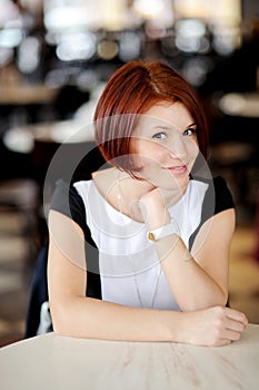 Portrait of beautiful woman with red hair