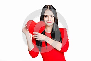 Portrait of a beautiful woman with red heart in hands.