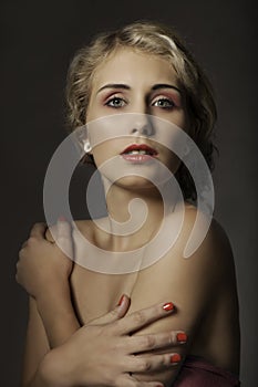 Portrait of beautiful woman with red makeup