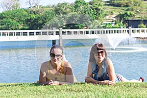 Portrait of beautiful woman relaxing during playing golf on a green field outdoors background. Tropical Bali island