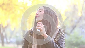 Portrait of beautiful woman singing with microphone