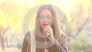 Portrait of beautiful woman singing with microphone