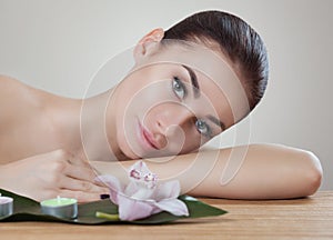 Portrait of a beautiful woman in a spa salon in front of a beauty treatment.