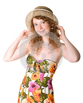 Portrait of a beautiful woman in a straw hat.