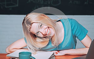 Portrait of a beautiful woman student. Teenager study online. Portrait of on college student on campus. Student studying