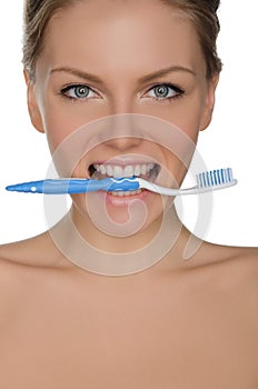 Portrait beautiful woman with toothbrush in teeth