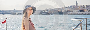 Portrait of beautiful woman tourist with view of Galata tower in Beyoglu, Istanbul, Turkey. Turkiye BANNER, LONG FORMAT