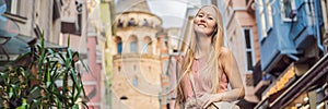 Portrait of beautiful woman tourist with view of Galata tower in Beyoglu, Istanbul, Turkey. Turkiye BANNER, LONG FORMAT