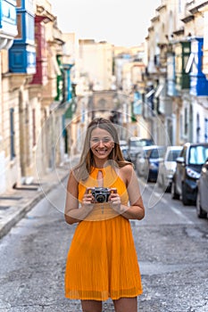 Portrait of a beautiful woman in a traditional Sliema alley. Malta