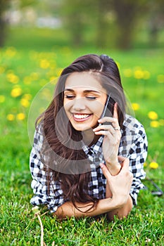 Portrait of a beautiful woman typing on the smart phone