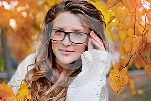 Portrait of beautiful woman wearing fashion glasses during the autumn