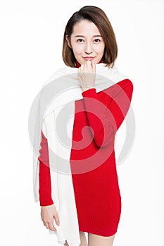 Portrait of beautiful woman wearing red dress against