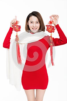 Portrait of beautiful woman wearing red dress against