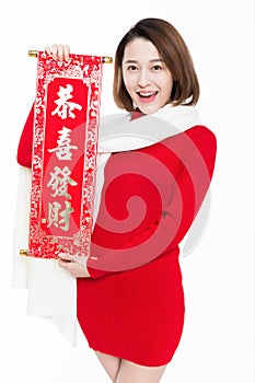 Portrait of beautiful woman wearing red dress against