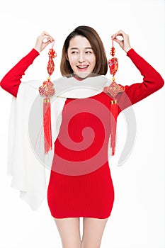 Portrait of beautiful woman wearing red dress against