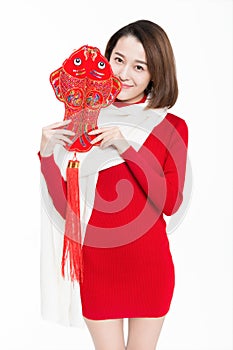 Portrait of beautiful woman wearing red dress against