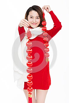 Portrait of beautiful woman wearing red dress against