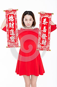 Portrait of beautiful woman wearing red dress against