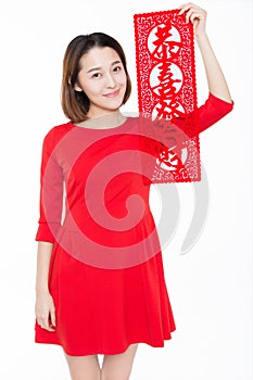 Portrait of beautiful woman wearing red dress against